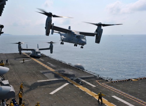 130219-N-VA915-079 GULF OF THAILAND (Feb. 19, 2013) ?An MV-22 Osprey assigned to Marine Medium Tiltrotor Squadron (VMM) 265 takes off from the flight deck of the forward-deployed amphibious assault ship USS Bonhomme Richard (LHD 6) as another Osprey prepares for take-off. The Bonhomme Richard ARG, currently on deployment in the U.S. 7th Fleet area of operations, is taking part in Cobra Gold, a Thai-U.S. co-sponsored multinational joint exercise designed to advance regional security by exercising a robust multinational force from nations sharing common goals and security commitments in the Asia-Pacific region. (U.S. Navy photo by Mass Communication Specialist 2nd Class Jerome D. Johnson/Released)