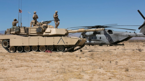 Marines of Company A, 1st Tank Battalion, prepare an M1A1 Abrams tank to receive fuel from a CH-53 Super Stallion with Marine Heavy Helicopter Squadron 465 at Acorn Training Area, July 16, 2015. Each tank has the capability to hold 500 gallons of fuel. (Official Marine Corps photo by Lance Cpl. Thomas Mudd/Released)