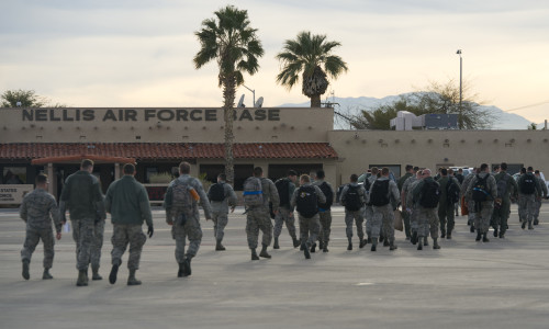 Team Tyndall members walk across the flight line Jan. 22 at Nellis AFB, Nev. The Airmen join more than 3,000 personnel from over 30 units including squadrons from Australia and the United Kingdom to participate in the most realistic combat training available.