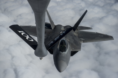 A U.S. Air Force F-22 Raptor approaches a USAF KC-135 Stratotanker for fuel over the Arabian Sea in support of Operation Inherent Resolve, Jan. 27, 2016. OIR is the coalition intervention against the Islamic State of Iraq and the Levant. (U.S. Air Force photo by Staff Sgt. Corey Hook/Released)