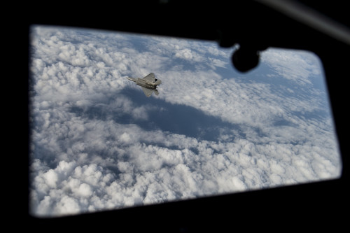 A U.S. Air Force F-22 Raptor flies over the Arabian Sea in support of Operation Inherent Resolve, Jan. 27, 2016. The F-22 is a fifth-generation aircraft and is designed to engage in air-to-air and air-to-ground missions. OIR is the coalition intervention against the Islamic State of Iraq and the Levant. (U.S. Air Force photo by Staff Sgt. Corey Hook/Released)