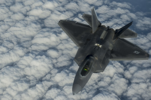 A U.S. Air Force F-22 Raptor flies over the Arabian Sea in support of Operation Inherent Resolve, Jan. 27, 2016. The F-22's combination of sensor capability, integrated avionics, situational awareness, and weapons provides first-kill opportunity against threats. OIR is the coalition intervention against the Islamic State of Iraq and the Levant. (U.S. Air Force photo by Staff Sgt. Corey Hook/Released)