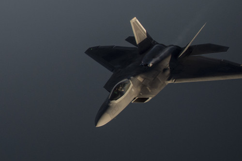A U.S. Air Force F-22 Raptor flies over the Arabian Sea in support of Operation Inherent Resolve, Jan. 27, 2016. The F-22 is a fifth-generation aircraft and is designed to engage in air-to-air and air-to-ground missions. OIR is the coalition intervention against the Islamic State of Iraq and the Levant.  (U.S. Air Force photo by Staff Sgt. Corey Hook/Released)