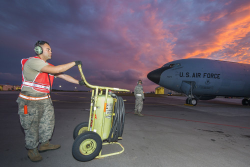 U.S. Air Force aircraft maintainers from the 909th Aircraft Maintenance Unit prepare a KC-135 Stratotanker for takeoff during Forceful Tiger Jan. 28, 2016, at Kadena Air Base, Japan. Thanks to the maintainers at the 909th AMU, the 909th Air Refueling Squadron was able to generate 15 KC-135 sorties with a 100-percent mission success rate for the large force exercise. (U.S. Air Force photo by Staff Sgt. Maeson L. Elleman)