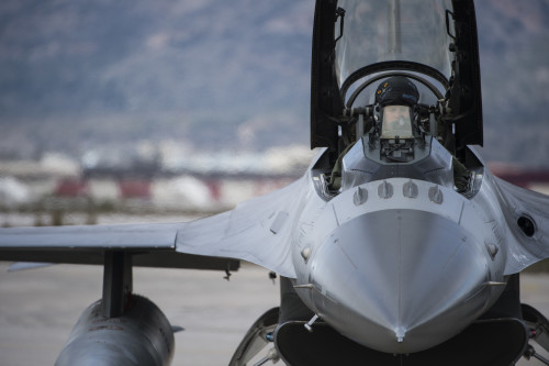 A U.S. Air Force pilot from the 480th Expeditionary Fighter Squadron prepares for flight in an F-16 Fighting Falcon fighter aircraft during a flying training deployment on the flightline at Souda Bay, Greece, Jan. 27, 2016. The training covered basic and air combat maneuvers aimed at honing the skills between the Greek and U.S. Air Forces. (U.S. Air Force photo by Staff Sgt. Christopher Ruano/Released)