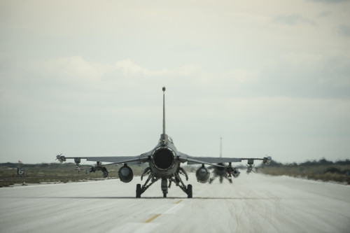 A U.S. Air Force pilot from the 480th Expeditionary Fighter Squadron taxis an F-16 Fighting Falcon fighter aircraft during a flying training deployment on the flightline at Souda Bay, Greece, Jan. 27, 2016. The training took place on the northwest bay of Crete, alongside the island's White Mountain range and over the Mediterranean Sea. (U.S. Air Force photo by Staff Sgt. Christopher Ruano/Released)