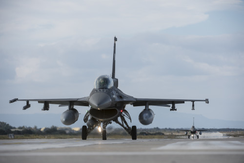 Hellenic air force F-16 Fighting Falcon fighter aircraft assigned to the 340th Fighter Squadron taxi on the flightline during a flying training deployment at Souda Bay, Greece, Jan. 27, 2016. The U.S. Air Force conducts military training with allies and partners to bolster operational readiness and capability. (U.S. Air Force photo by Staff Sgt. Christopher Ruano/Released)