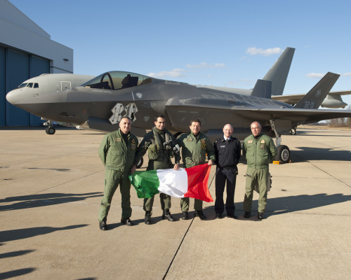 160205-O-ZZ999-961 NAS Patuxent River (February 5, 2016) Italian Air Force (Aeronautica Militare) personnel celebrate after an F-35A Lightning II aircraft made aviation history by completing the very first F-35 trans-Atlantic Ocean crossing, arriving at Naval Air Station Patuxent River, Md., from Cameri Air Base, Italy, on Feb. 5 at 2:24 p.m. EST. F-35A aircraft AL-1, the first international jet fully built overseas at the Cameri Final Assembly & Check-Out (FACO) facility at Cameri Air Base, Italy, is also the first F-35 assembled outside of the U.S. to land on U.S. soil.  (U.S. Navy photo courtesy Andy Wolfe/Released)