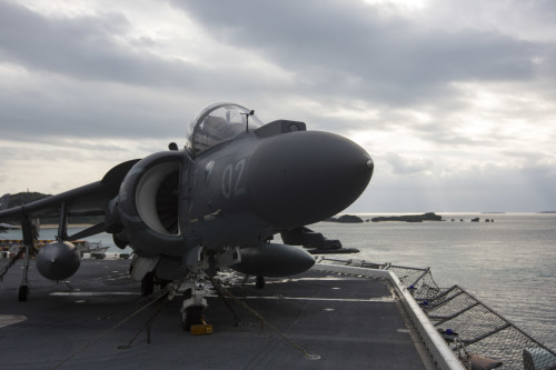 An AV-8B Harrier with Marine Attack Squadron 214, 31st Marine Expeditionary Unit, sits on the flight deck of the USS Bonhomme Richard (LHD 6) as it pulls out of port at White Beach, Okinawa, Japan, Feb. 6, 2016. The Marines and sailors of the 31st MEU and the Bonhomme Richard Amphibious Ready Group are currently on their spring deployment to the Asia-Pacific region. (U.S. Marine Corps photo by Gunnery Sgt. Zachary Dyer/Released)