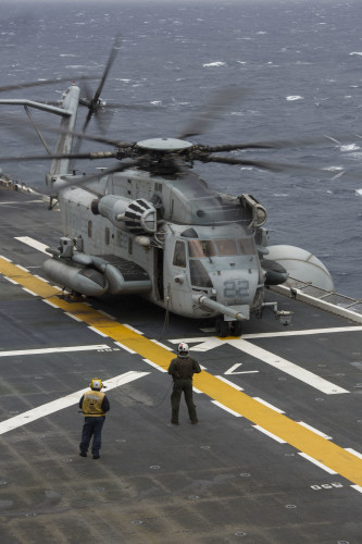 A CH-53E Super Stallion with Marine Medium Tiltrotor Squadron 265 (Reinforced), 31st Marine Expeditionary Unit, waits on the flight deck of the USS Bonhomme Richard (LHD 6) for clearance to take off Feb. 6, 2016. The Marines of VMM-265 (Rein.), 31st MEU, were conducting deck landing qualifications with the various aircraft of the 31st MEU's aviation combat element. The 31st MEU is currently embarked on the ships of the Bonhomme Richard Amphibious Ready Group on their spring deployment to the Asia-Pacific region. (U.S. Marine Corps photo by Gunnery Sgt. Zachary Dyer)