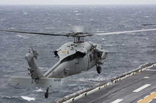 A Navy MH-60S Seahawk belonging to Helicopter Sea Combat Squadron 25 takes off from the flight deck of the USS Bonhomme Richard (LHD 6) Feb. 6, 2016. The Marines and sailors of the 31st Marine Expeditionary Unit are currently embarked on the ships of the Bonhomme Richard Amphibious Ready Group on their spring deployment to the Asia-Pacific region. (U.S. Marine Corps photo by Gunnery Sgt. Zachary Dyer)