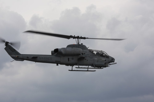 An AH-1W Super Cobra with Marine Medium Tiltrotor Squadron 265 (Reinforced), 31st Marine Expeditionary Unit, flies over the USS Bonhomme Richard (LHD 6) Feb. 6, 2016. The Marines of VMM-265 (Rein.), 31st MEU, were conducting deck landing qualifications with the various aircraft of the 31st MEU's aviation combat element. The 31st MEU is currently embarked on the ships of the Bonhomme Richard Amphibious Ready Group on their spring deployment to the Asia-Pacific region. (U.S. Marine Corps photo by Gunnery Sgt. Zachary Dyer)