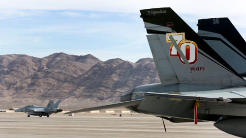 A Royal Australian Air Force No 1 Squadron F/A-18F Super Hornet (left) taxis on the Nellis Air Force Base flightline during Exercise Red Flag 16-1. *** Local Caption *** Exercise Red Flag 16-1 is an air combat training exercise which centres on the large force employment of aircraft in a high-end warfighting environment.  RF16-1 is being conducted from Nellis Air Force Base in Nevada, United States, from 25 January to 12 February 2016.  The aircraft will participate in the Nevada Test and Training Range (NTTR), and involve participants from the United States Air Force (USAF), United States Navy (USN), Royal Air Force (RAF) and Royal Australian Air Force (RAAF).