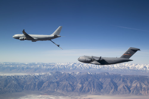 A Royal Australian Air Force (RAAF) KC-30A Multi-Role Tanker Transport (MRTT) in a 'pre-contact' position with a United States Air Force C-17A Globemaster III transport. *** Local Caption *** On 10 February 2016, a RAAF KC-30A Multi-Role Tanker Transport (MRTT) conducted its first air-to-air refuelling with a C-17A Globemaster III transport, flying from Edwards Air Force Base in California. The five-hour sortie saw 39 contacts between the KC-30A and C-17A aircraft, with approximately 6,800 kilograms of fuel transferred to the C-17A via the KC-30As Advanced Refuelling Boom System (ARBS). The trial is part of a series of flights being made by a KC-30A with a range of USAF aircraft, and is a precursor to refuelling the RAAF's own C-17As in the near future.