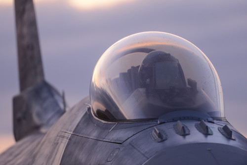A U.S. Air Force pilot from the 480th Expeditionary Fighter Squadron prepares for flight in an F-16 Fighting Falcon fighter aircraft during a flying training deployment on the flightline at Souda Bay, Greece, Jan. 28, 2016. Through engagements such as these that strengthen relationships with allies and partners, the U.S. demonstrates its shared commitment to a safe and secure Europe. (U.S. Air Force photo by Staff Sgt. Christopher Ruano/Released)