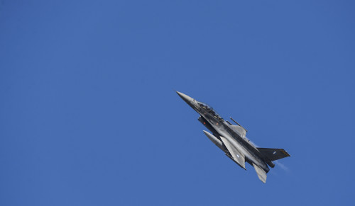 A Hellenic air force F-16 Fighting Falcon fighter aircraft assigned to the 340th Fighter Squadron soars over the flightline during a flying training deployment at Souda Bay, Greece, Jan. 28, 2016. The training covered basic and air combat maneuvers aimed at honing the skills between the Greek and U.S. air forces. (U.S. Air Force photo by Staff Sgt. Christopher Ruano/Released)