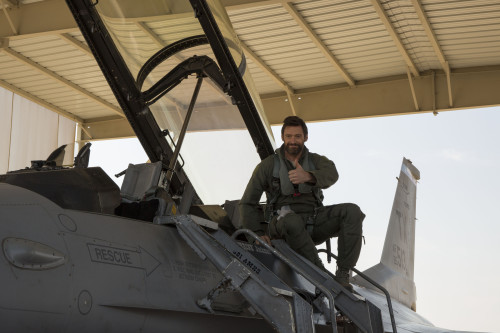 Hugh Jackman gives a thumbs up to the crowd as he prepares to ingress the F-16D Fighting Falcon prior to his flight Feb. 19 at Naval Air Station Fort Worth Joint Reserve Base. Jackman, who was visiting the installation as part of a promotional tour for the movie "Eddie The Eagle," was flown by Lt. Col. David Efferson, 457th Fighter Squadron commander. (U.S. Marine Corps photo by Cpl. Luis Ramirez/Released)