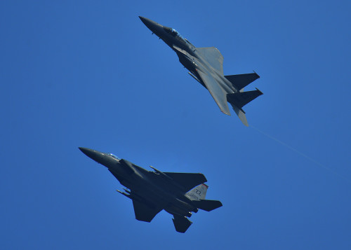 Two F-15 Eagles from 67th Fighter Squadron, Kadena Air Base, Japan, break formation in preparation to land during Exercise Cope Tiger 16, over Korat Royal Thai Air Force Base, Thailand, March 7, 2016. Exercise Cope Tiger 16 includes over 1,200 personnel from three countries and continues the growth of strong, interoperable and beneficial relationships within the Asia-Pacific Region, while demonstrating U.S. capability to project forces strategically in a combined, joint environment. (U.S. Air Force Photo by Tech Sgt. Aaron Oelrich/Released)