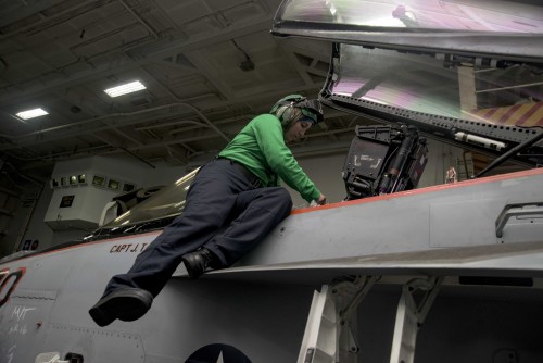 160319-N-KK394-139 ATLANTIC OCEAN (March 19, 2016) - Aviation Structural Mechanic (Equipment) Airman Britney Johnson inspects the cockpit of an F/A-18E Super Hornet assigned to the Sidewinders of Strike Fighter Squadron (VFA) 86 in the hangar bay of the aircraft carrier USS Dwight D. Eisenhower (CVN 69), the flagship of the Eisenhower Carrier Strike Group. Ike is underway conducting a Composite Training Unit Exercise (COMPTUEX) with the Eisenhower Carrier Strike Group in preparation for a future deployment. (U.S. Navy photo by Mass Communication Specialist 3rd Class Anderson W. Branch/Released)
