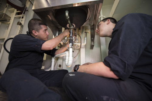 160320-N-BH414-016 ATLANTIC OCEAN (March 20, 2016) – Hull Maintenance Technician 3rd Class Christian Cruz (left) and Hull Maintenance Technician Fireman Michael Lloyd install a faucet in a head aboard the aircraft carrier USS Dwight D. Eisenhower (CVN 69), the flagship of the Eisenhower Carrier Strike Group. Ike is underway conducting a Composite Training Unit Exercise (COMPTUEX) with the Eisenhower Carrier Strike Group in preparation for a future deployment. (U.S. Navy photo by Mass Communication Specialist Seaman Apprentice Casey S. Trietsch/Released)