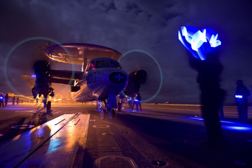 160320-N-OR652-575 ATLANTIC OCEAN (March 20, 2016) – An E-2C Hawkeye assigned to the Screwtops of Airborne Early Warning Squadron (VAW) 123, performs pre-flight checks on the flight deck of the aircraft carrier USS Dwight D. Eisenhower (CVN 69), the flagship of the Eisenhower Carrier Strike Group. Ike is underway conducting a Composite Training Unit Exercise (COMPTUEX) with the Eisenhower Carrier Strike Group in preparation for a future deployment. (U.S. Navy photo by Mass Communication Specialist 3rd Class J. Alexander Delgado/Released)