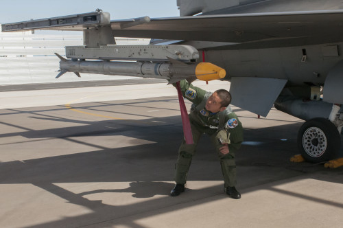 First Lt. Fumita Sakyu does a final inspection of his F-16 Fighting Falcon prior to taking off for a training sortie at the Arizona Air National Guard’s 162nd Wing located at Tucson International Airport. Japan turned to the premier training program here after a massive earthquake triggered a tsunami that devastated its northeast coast. Although there are no F-16s in the Japanese inventory, their multi-role F-2 is based on the F-16 design, with modifications to meet the needs of the JASDF. (U.S. Air National Guard photo by 2nd Lt. Lacey Roberts)