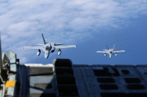Spanish Air Force F/A-18 Hornets with 462 Squadron approach in formation during an air-to-air refuel mission with a U.S. Marine Corps KC-130J with Marine Aerial Refueler Transport Squadron 252, Special-Purpose Marine Air-Ground Task Force-Crisis Response- Africa, Gran Canaria, Spain, Mar. 29, 2016. SPMAGTF-CR-AF Marines and Spanish airmen conducted air-to-air refueling missions in order to enhance crisis response readiness and help build relationships between the two militaries. (U.S. Marine Corps photo by Sgt. Kassie L. McDole/Released)