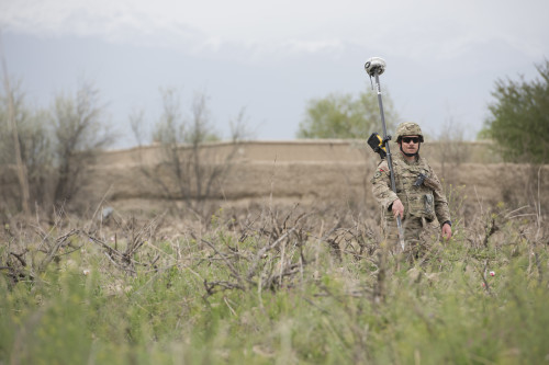 An 455th Expeditionary Civil Engineer Squadron Airman carries a GPS surveying instrument at an F-16 Fighting Falcon Crash site in Khanjar Khel, Parwan Province, Afghanistan, March 30, 2016. The F-16 crashed after takeoff and the pilot safely ejected; since then, the base completed cleaning up the crash site. The cause of the accident is under investigation. (U.S. Air Force photo/Tech. Sgt. Robert Cloys)