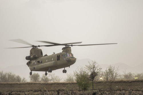 A CH-47 Chinook hovers over an F-16 Fighting Falcon crash site in Khanjar Khel, Parwan Province, Afghanistan, before slingloading munitions and aircraft parts for transport back to Bagram Airfield, Afghanistan, March 30, 2016. The F-16 crashed after takeoff and the pilot safely ejected; since then, the base completed cleaning up the crash site. The cause of the accident is under investigation. (U.S. Air Force photo/Tech. Sgt. Robert Cloys)