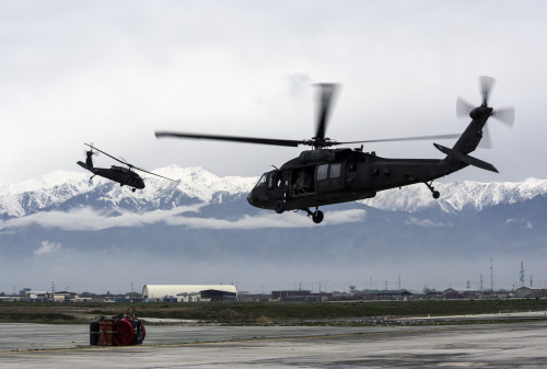 Two UH-60 Black Hawk helicopters, assigned to Task Force – Iron Eagle, transport Airmen from Bagram Airfield, Afghanistan, to the site of an F-16 Fighting Falcon crash during recovery efforts Mar. 31, 2016. The F-16 crashed after takeoff and the pilot safely ejected; since then, the base completed cleaning up the crash site. The cause of the accident is under investigation. (U.S. Air Force photo by Tech. Sgt. Nicholas Rau)