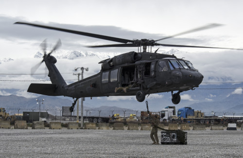 Soldiers assigned to Task Force – Iron Eagle prepare to connect a sling load to a UH-60 Black Hawk helicopter at Bagram Airfield, Afghanistan, to transport it to the site of an F-16 Fighting Falcon crash during recovery efforts Mar. 31, 2016. The F-16 crashed after takeoff and the pilot safely ejected; since then, the base completed cleaning up the crash site. The cause of the accident is under investigation. (U.S. Air Force photo by Tech. Sgt. Nicholas Rau)
