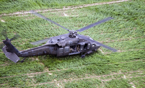 A UH-60 Black Hawk helicopter, assigned to Task Force – Iron Eagle, prepares to lift off after delivering supplies to Airmen from Bagram Airfield, Afghanistan, at the site of an F-16 Fighting Falcon crash during recovery efforts Mar. 31, 2016. The F-16 crashed after takeoff and the pilot safely ejected; since then, the base completed cleaning up the crash site. The cause of the accident is under investigation. (U.S. Air Force photo by Tech. Sgt. Nicholas Rau)