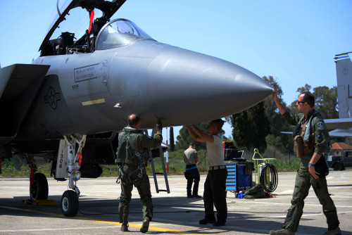 A pilot, weapon systems officer, and maintenance Airmen from the 48th Fighter Wing, Royal Air Force Lakenheath, England, inspect an F-15E Strike Eagle aircraft prior to a mission, April 4, 2016, during exercise INIOHOS 16 at Andravida Air Base, Greece. Twelve F-15E Strike Eagles from the 492nd Fighter Squadron and approximately 260 U.S. Air Force Airmen are participating in the training event through April 15, 2016. (U.S. Air Force photo by Tech. Sgt. Eric Burks/Released)