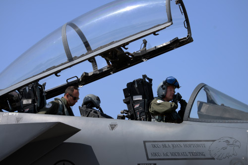 A pilot and weapon systems officer assigned to the 492nd Fighter Squadron, Royal Air Force Lakenheath, England, prepare to fly a mission in a U.S. Air Force F-15E Strike Eagle aircraft, April 4, 2016, during exercise INIOHOS 16 at Andravida Air Base, Greece. Training engagements such as INIOHOS 16 strengthen our relationships, maintain joint readiness and interoperability, and reassure our regional allies and partners. (U.S. Air Force photo by Tech. Sgt. Eric Burks/Released)