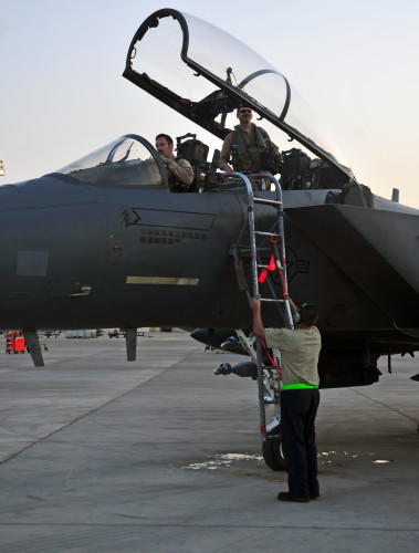 Lt. Col. Bash, top right, 391st Expeditionary Fighter Squadron weapons system officer and instructor, prepares to disembark from a F-15E Strike Eagle fighter aircraft after returning from a combat mission at an undisclosed location in Southwest Asia, April 9, 2016. Bash, a 14-year veteran of the F-15, flew his first combat mission from Al Uldeid in 2003 where he sortied over the deserts of Iraq during Operation Iraqi Freedom. (U. S. Air Force photo by Staff Sgt. Kentavist P. Brackin/Released)