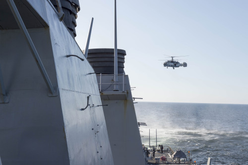160412-N-ZZ999-003 BALTIC SEA (April 12, 2016) A Russian Kamov KA-27 HELIX helicopter flies low-level passes near the Arleigh Burke-class guided missile destroyer USS Donald Cook (DDG 75) while the ship was operating in international waters April 12, 2016. Donald Cook is forward deployed to Rota, Spain, and is conducting routine patrols in the U.S. 6th Fleet area of operations in support of U.S. national security interests in Europe.  (U.S. Navy photo/Released)