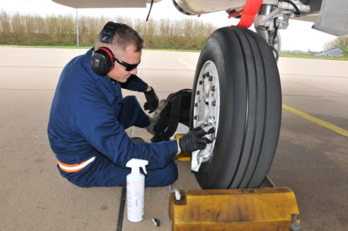 U.S. Air Force and Massachusetts Air National Guard Staff Sgt. Taylor Steadman inspects the wheel of an F-15C Eagle aircraft for cracks and leaks, April 19, 2016, Leeuwarden Air Base, Netherlands.