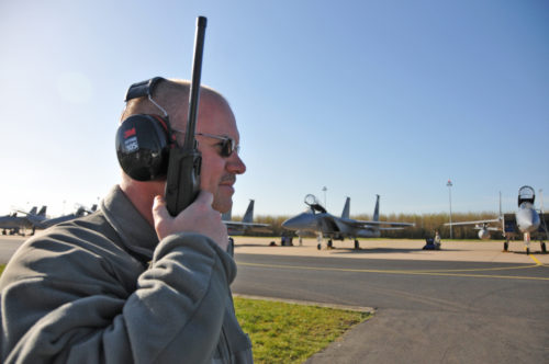 U.S. Air Force and Massachusetts Air National Guard production superintendents Senior Master Sgt. Roy Walkins monitors the radio during morning Frisian Flag 2016 F-15C/D Eagle launch. The Royal Netherlands Air Force exercise is designed to foster military cooperation between participating nations and these types of exchanges help establish trust and relationships, April 21, 2016.
