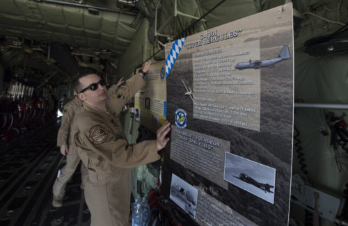 U.S. Air Force Technical Sergeant Matthew Miller, a crew chief with the 86th Aircraft Maintenance Squadron, displays a display poster within a U.S. Air Force C-130J Hercules during the International Marrakech Airshow in Morocco on Apr. 27 2016.TSgt Miller is part of a six-man flight crew entrusted with transporting the aircraft to the 2016 International Marrakech Airshow in Morocco and showcasing the aircrafts capabilities for spectators. (DoD News photo by TSgt Brian Kimball)