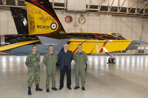 Left to Right: Chief Warrant Officer (CWO) Alain Roy, the 4 Wing Cold Lake’s CWO, Colonel Eric Kenny, 4 Wing Cold Lake’s Base Commander, Mr. Jim Belliveau, design and paint crew lead, and Captain Ryan Kean, the CF-18 Demonstration pilot, during the CF-18 Demonstration Jet unveiling ceremony held at Hangar 2, 4 Wing Cold Lake, Alberta, on April 5, 2016. Image by: Cpl Bryan Carter, 4 Wing Imaging, CK04-2016-0278-004