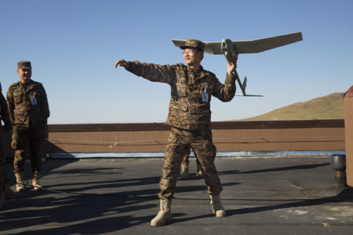 Mongolian Armed Forces Lt. Col. B. Baasaadorj practices the steps of launching an unmanned aerial vehicle May 27 during the UAV training portion of Khaan Quest 2016 at Five Hills Training Area near Ulaanbaatar, Mongolia. The training equipped MAF members with a deeper understanding of the purpose and operations of UAVs and how they can be used during peacekeeping missions. Khaan Quest 2016 is an annual, multinational peacekeeping operations exercise hosted by the Mongolian Armed Forces, co-sponsored by U.S. Pacific Command, and supported by U.S. Army Pacific and U.S. Marine Corps Forces, Pacific. Khaan Quest, in its 14th iteration, is the capstone exercise for this year’s Global Peace Operations Initiative program. The exercise focuses on training activities to enhance international interoperability, develop peacekeeping capabilities, build to mil-to-mil relationships, and enhance military readiness. (U.S. Marine Corps Photo by Cpl. Janessa K. Pon)