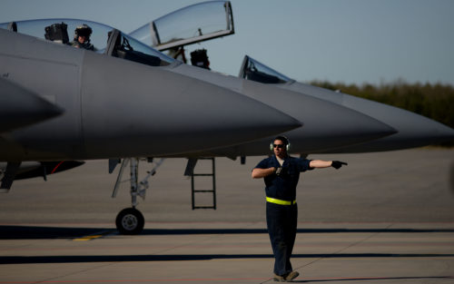 An F-15C Eagle crew chief marshalls out an aircraft prior to a sortie launch from Amari Air Base, Estonia in support of exercise Spring Storm May 6. The U.S.131st Expeditionary Fighter Squadron will fly with the Estonian Defense Force and Polish air force to improve allied air operations and interoperability in a realistic training environment. (U.S. Air Force photo/ Tech. Sgt. Matthew Plew)