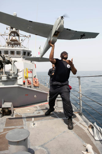 160722-N-GC639-088 ARABIAN GULF (July 22, 2016)  Electronics Technician 2nd Class Darius Jackman launches a Puma unmanned aerial vehicle (UAV) from the patrol coastal ship USS Monsoon (PC 4). Monsoon is one of ten patrol coastal ships assigned to Patrol Coastal Squadron (PCRON) 1 home-ported in Manama, Bahrain in support of maritime security operations and theater security cooperation efforts in the U.S. 5th Fleet area of operation. (U.S. Navy photo by Mass Communication Specialist 2nd Class Ryan D. McLearnon/Released)