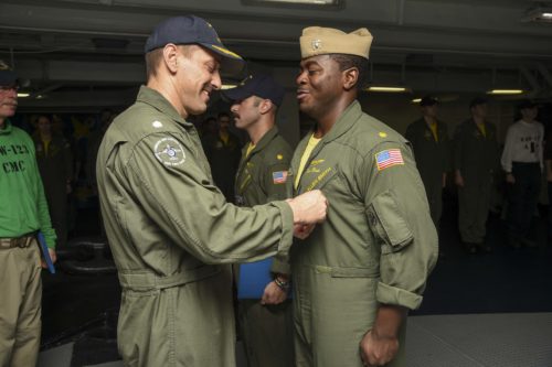 160729-N-CZ759-002 ARABIAN GULF (July 29, 2016) Lt. Cmdr. Kellen Smith, assigned to the Screwtops of Airborne Early Warning Squadron (VAW) 123 is awarded the Air Medal in the forecastle of the aircraft carrier USS Dwight D. Eisenhower (CVN 69) (Ike). Ike and its Carrier Strike Group are deployed in support of Operation Inherent Resolve, maritime security operations and theater security cooperation efforts in the U.S. 5th Fleet area of operations. (U.S. Navy photo by Mass Communication Specialist 3rd Class Theodore Quintana/Released)