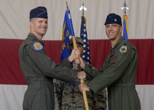 Col. Benjamin Bishop, 56th Operations Group commander, passes the guidon to Lt. Col. Matthew Vedder as he assumes command of the 63rd Fighter Squadron Aug. 1, 2016 at Luke Air Force Base, Ariz. The 63rd FS is scheduled to begin accepting F-35 Lightning II jets in March 2017 and will be joined by partner nation Turkey. (U.S. Air Force photo by Senior Airman Devante Williams)