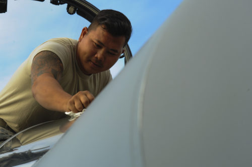 California Air National Guard Staff Sgt. Tee Xiong, a 194th Expeditionary Fighter Squadron crew chief, cleans the windshield of an F-15C Eagle fighter aircraft on the flightline at Graf Ignatievo, Bulgaria, Sept. 8, 2016. Four of the squadron’s F-15Cs will conduct joint NATO air policing missions with the Bulgarian air force to police the host nation’s sovereign airspace Sept. 9-16, 2016. The squadron forward deployed to Graf Ignatievo from Campia Turzii, Romania, where they serve on a theater security package deployment to Europe as a part of Operation Atlantic Resolve. (U.S. Air Force photo by Staff Sgt. Joe W. McFadden)