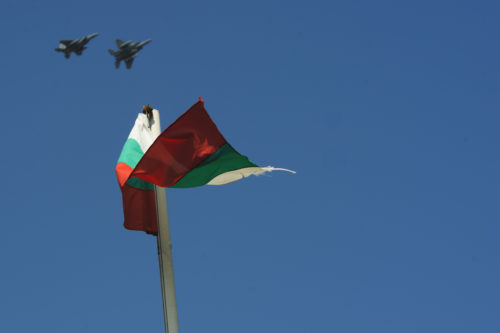 Two California Air National Guard F-15C Eagles fly over a Bulgarian Flag near the flightline at Graf Ignatievo, Bulgaria, Sept. 8, 2016. Four of the 194th Expeditionary Fighter Squadron’s F-15C Eagles will conduct joint NATO air policing missions with the Bulgarian air force to police the host nation’s sovereign airspace Sept. 9-16, 2016. The squadron forward deployed to Graf Ignatievo from Campia Turzii, Romania, where they serve on a theater security package deployment to Europe as a part of Operation Atlantic Resolve. (U.S. Air Force photo by Staff Sgt. Joe W. McFadden)