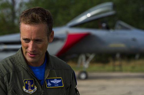 California Air National Guard Lt. Col. Matthew Ohman, a 194th Expeditionary Fighter Squadron F-15C Eagle fighter aircraft pilot, speaks during an interview with one of his squadron’s aircraft in the background on the flightline during joint NATO air policing at Graf Ignatievo, Bulgaria, Sept. 9, 2016. Four California and Massachusetts ANGs’ F-15Cs and approximately 75 Airmen from the 194th EFS deployed to Graf Ignatievo, Bulgaria, and will stand ready as interceptors, prepared to quickly react to any violations and infringements for policing of Bulgarian airspace Sept. 9-16, 2016. The squadron forward deployed to Graf Ignatievo from Campia Turzii, Romania, where they serve on a theater security package deployment to Europe as a part of Operation Atlantic Resolve.  (U.S. Air Force photo by Staff Sgt. Joe W. McFadden/Released)