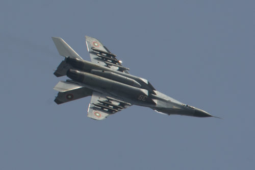 A Bulgarian air force Mikoyan MiG-29 Fulcrum fighter aircraft assigned to the 3rd Air Force Base flies over the flightline during joint NATO air policing at Graf Ignatievo, Bulgaria, Sept. 8, 2016. Four California and Massachusetts Air National Guards’ F-15C Eagle fighter aircraft and approximately 75 Airmen from the 194th Expeditionary Fighter Squadron deployed to Graf Ignatievo, Bulgaria, and will stand ready as interceptors, prepared to quickly react to any violations and infringements for policing of Bulgarian airspace Sept. 9-16, 2016. The squadron forward deployed to Graf Ignatievo from Campia Turzii, Romania, where they serve on a theater security package deployment to Europe as a part of Operation Atlantic Resolve.  (U.S. Air Force photo by Staff Sgt. Joe W. McFadden/Released)
