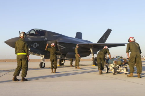 U.S. Marines with Marine Fighter Attack Squadron 121 (VMFA-121), 3rd Marine Aircraft Wing,  conduct the first ever hot load on the F-35B Lightning II in support of Weapons and Tactics Instructor Course (WTI) 1-17 at Marine Corps Air Station Yuma, Ariz., Sept. 22, 2016. The exercise is part of WTI 1-17, a seven-week training event hosted by Marine Aviation Weapons and Tactics Squadron One (MAWTS-1) cadre. MAWTS-1 provides standardized tactical training and certification of unit instructor qualifications to support Marine Aviation Training and Readiness and assists in developing and employing aviation weapons and tactics. (U.S. Marine Corps photograph by SSgt. Artur Shvartsberg, MAWTS-1 COMCAM)